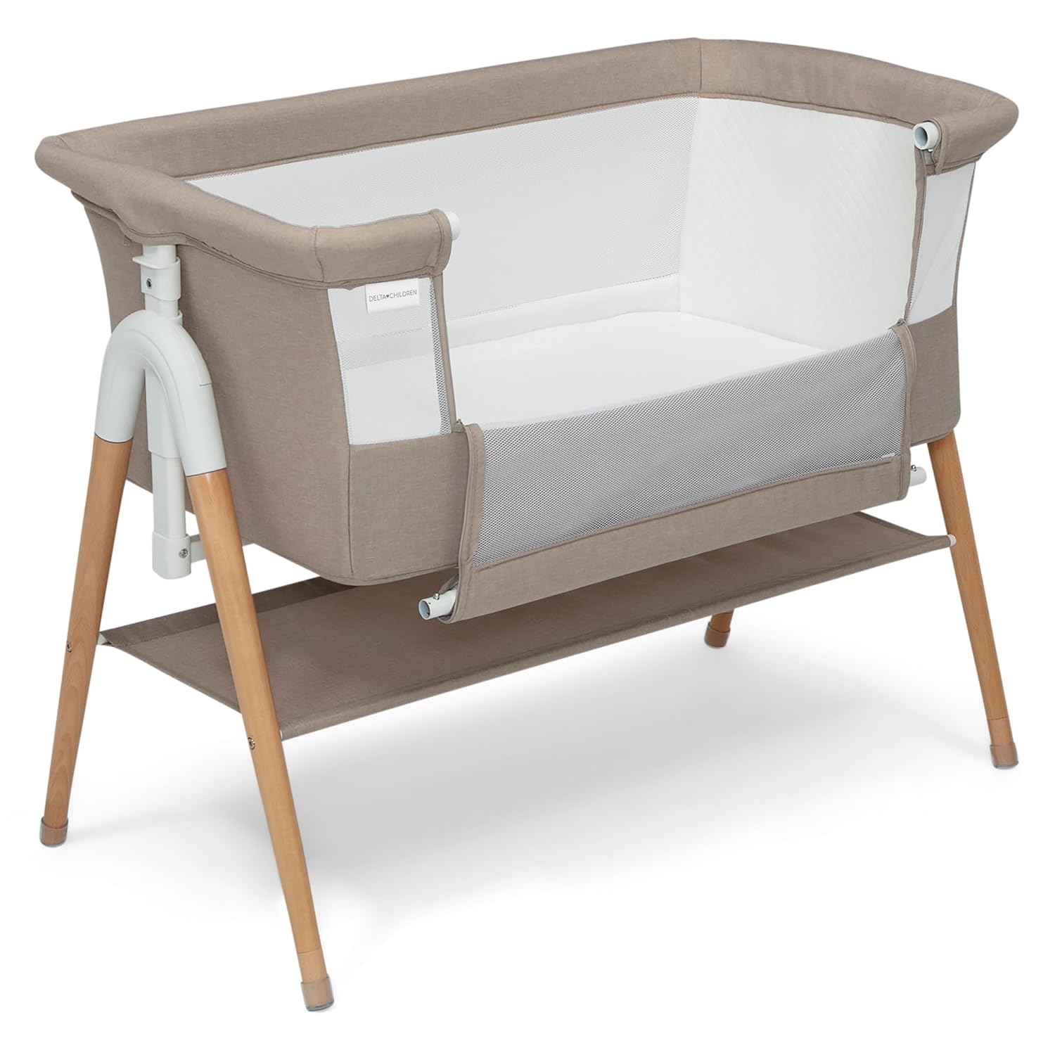Delta Children Bondi — A bassinet that reads as furniture.
